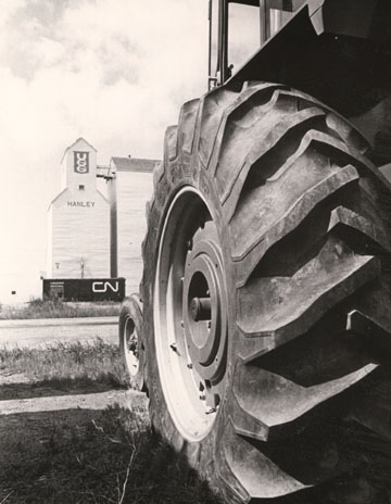 Elevator and tractor
